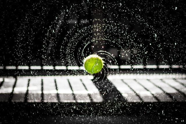 Wet tennis ball rotating quickly